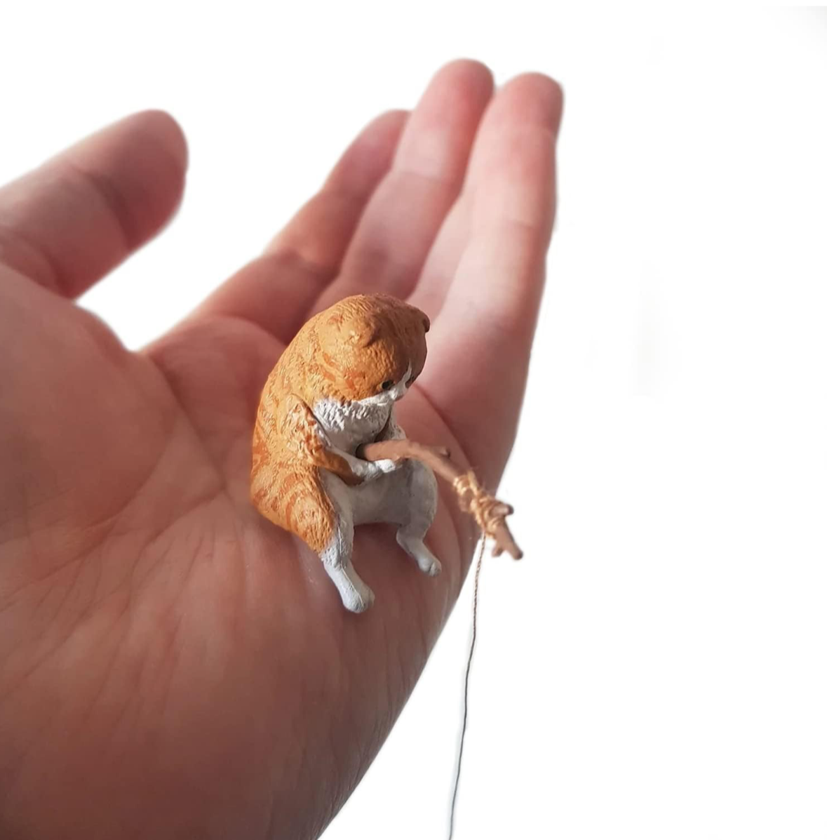 orange fishing gashapon cat