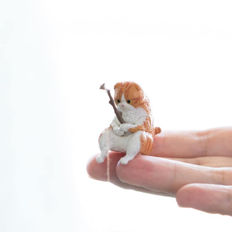 orange fishing gashapon cat